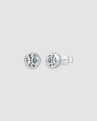 2Ct Round Bubble Moissanite studs in sterling silver with a rhodium finish, featuring a modern bezel setting.