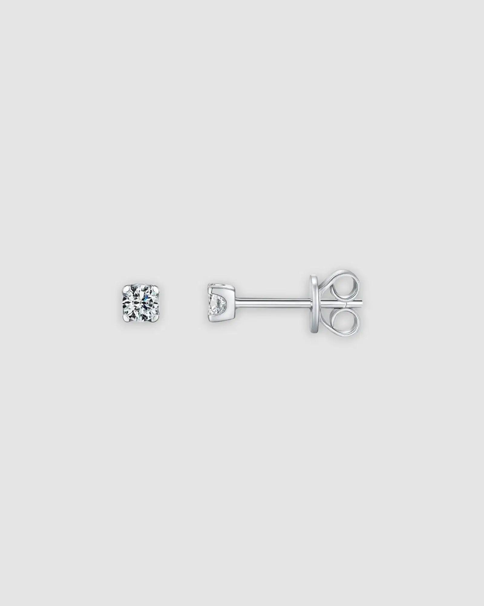 3mm Round brilliant cut moissanite studs in sterling silver with rhodium finish, showcasing a classic prong setting.
