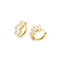 Elegant gold hoop earrings adorned with sparkling clear stones, perfect for adding a touch of glamour to any outfit.