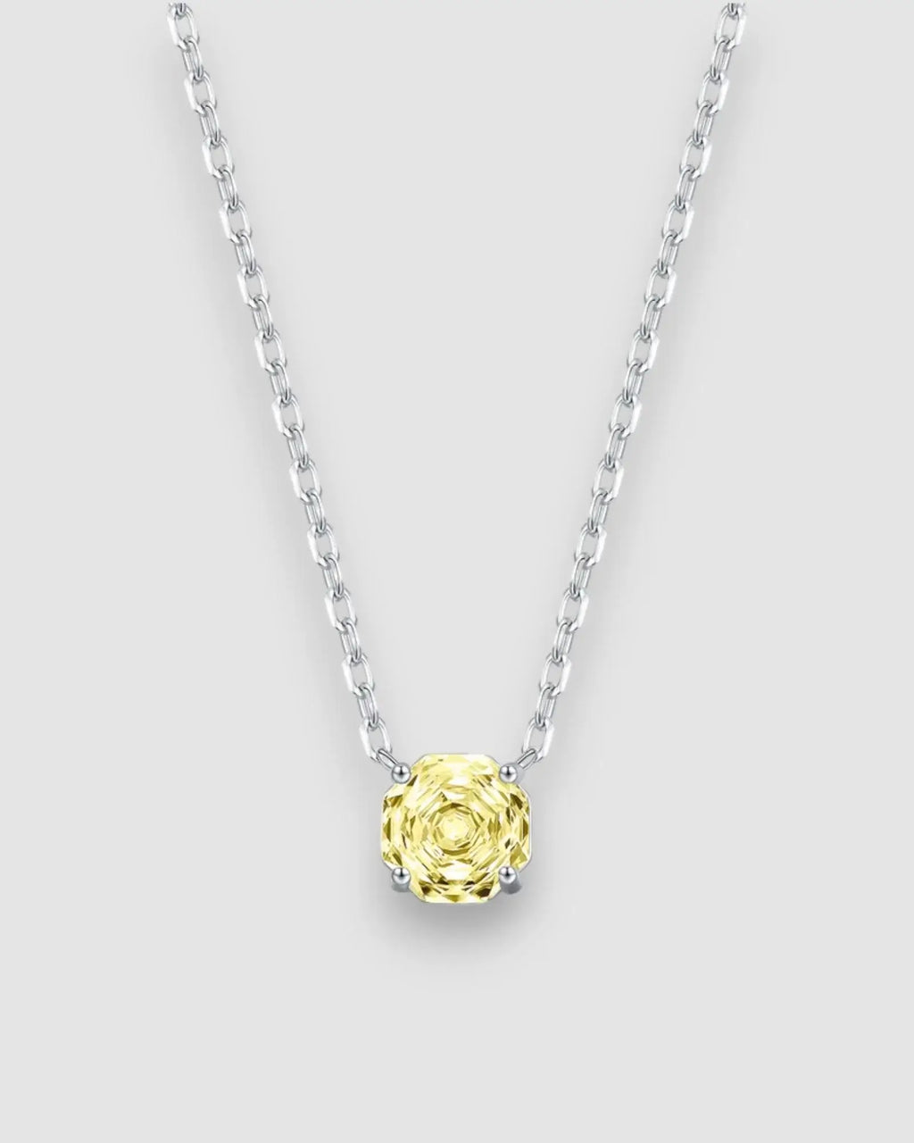 Yellow zircon pendant necklace in silver featuring octagonal rose cut stone, adjustable chain for versatile styling.