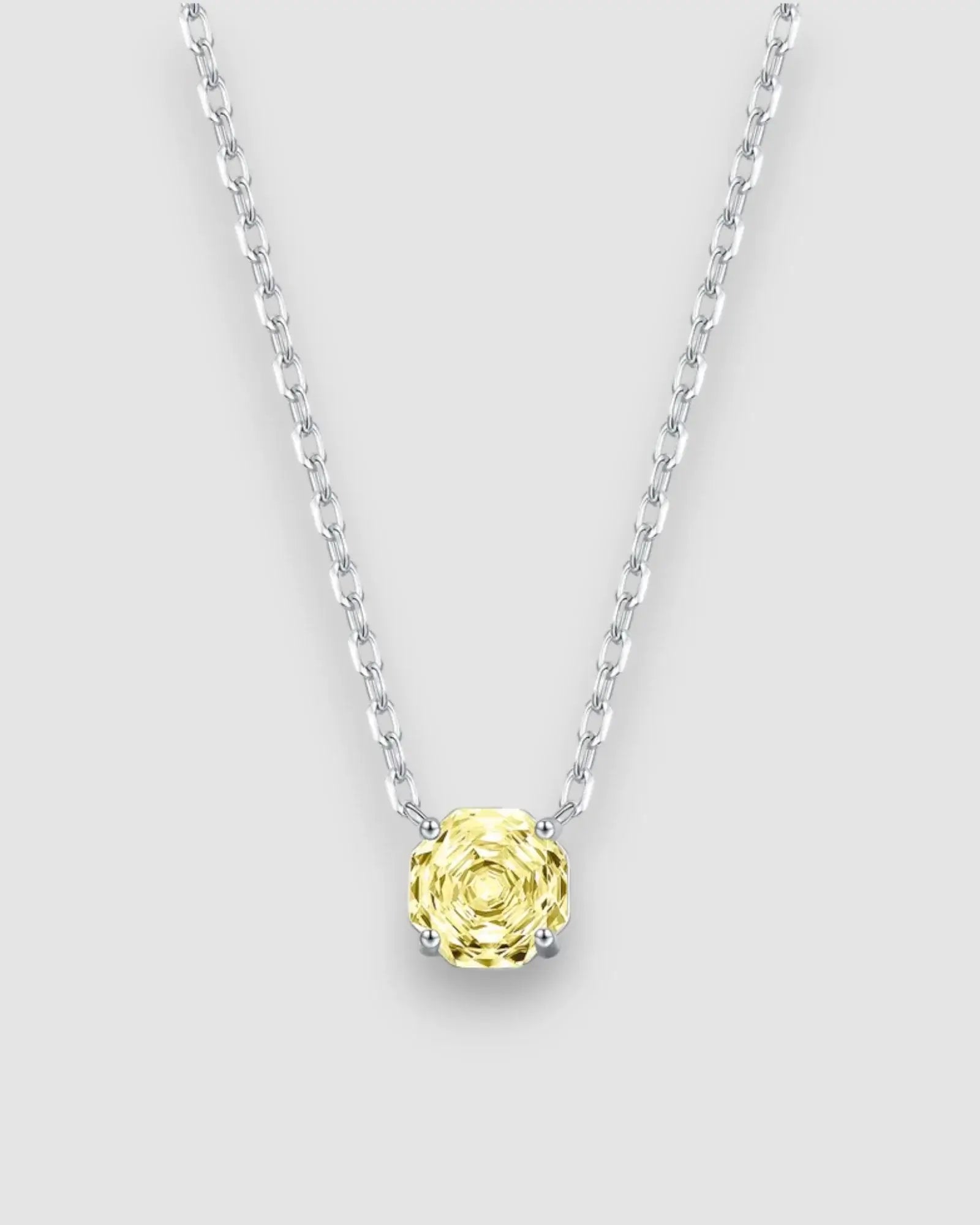 Yellow zircon pendant necklace in silver featuring octagonal rose cut stone, adjustable chain for versatile styling.