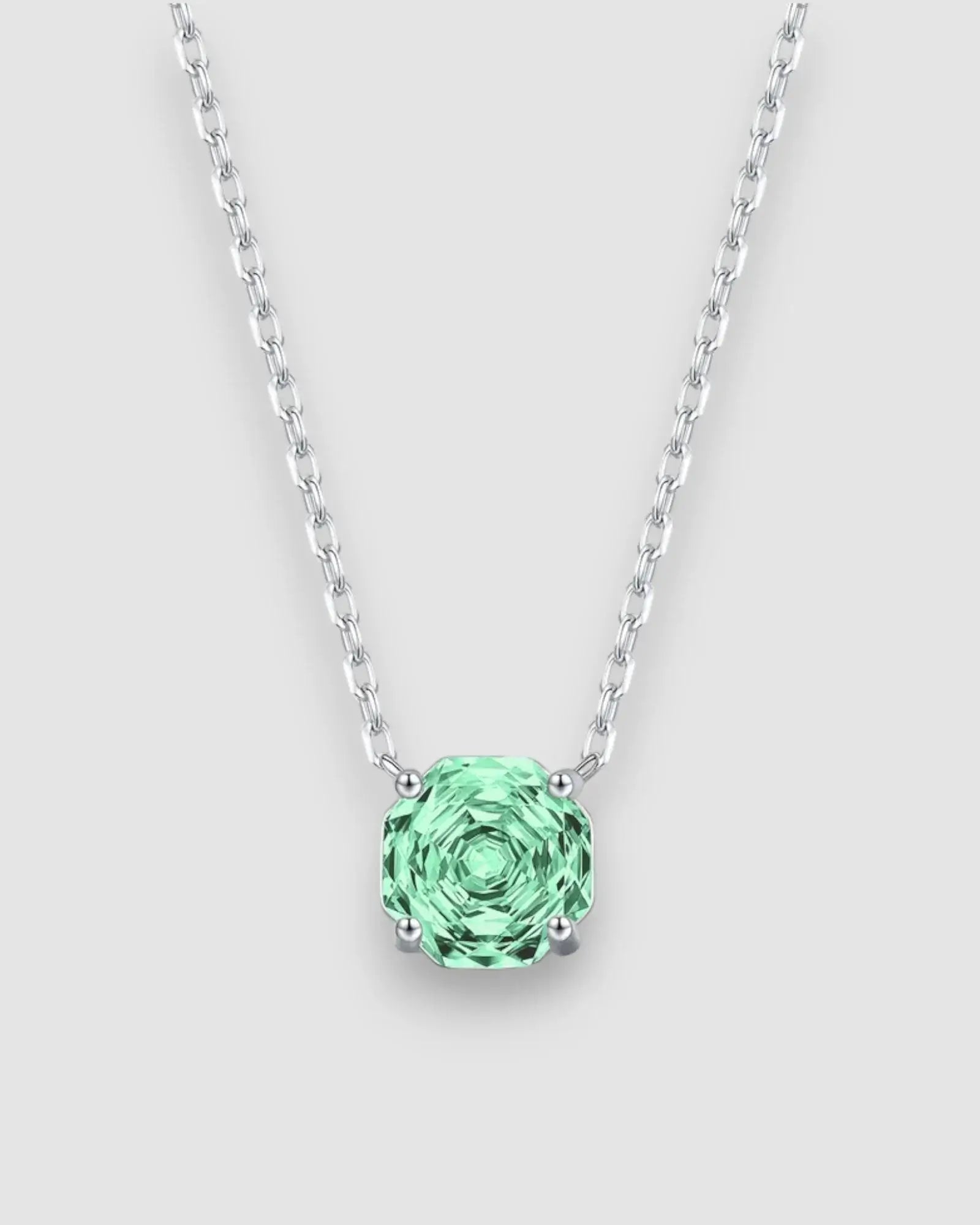 Octagonal rose cut green zircon pendant necklace in silver on a chain, showcasing a vibrant gem.