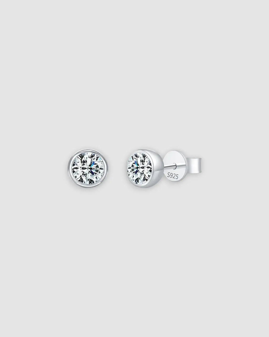 1Ct Round Bubble moissanite studs in sterling silver with rhodium finish, featuring a modern bezel setting.