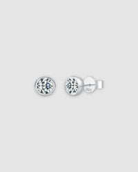 1Ct Round Bubble moissanite studs in sterling silver with rhodium finish, featuring a modern bezel setting.