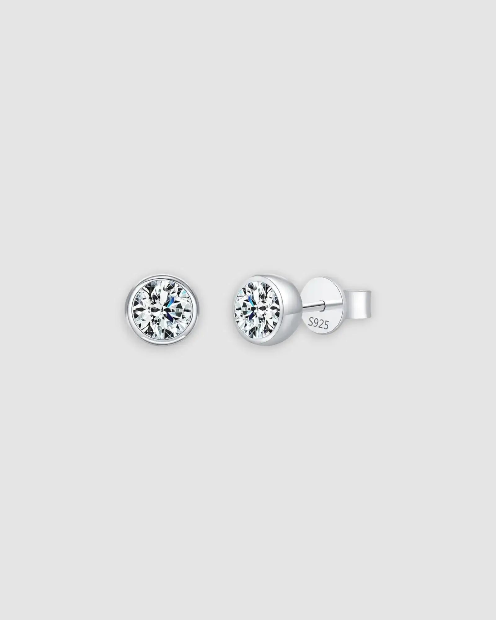 1Ct Round Bubble moissanite studs in sterling silver with rhodium finish, featuring a modern bezel setting.