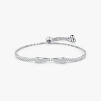 Elegant adjustable bow knot bracelet in sterling silver with zircon stone pave design.
