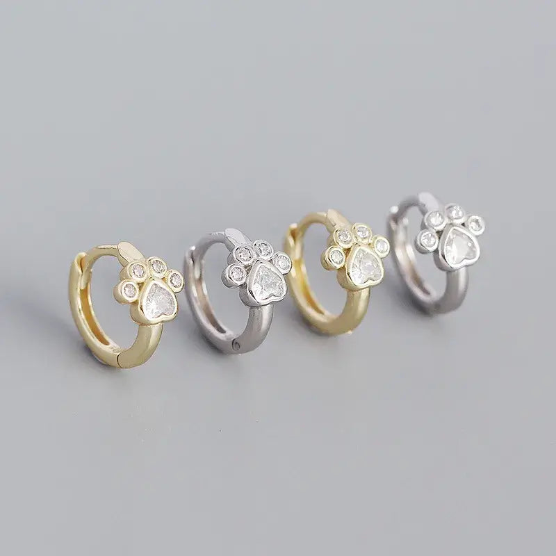 Cat footprint hoop earrings in yellow gold and sterling silver with paw design, perfect for everyday elegance.