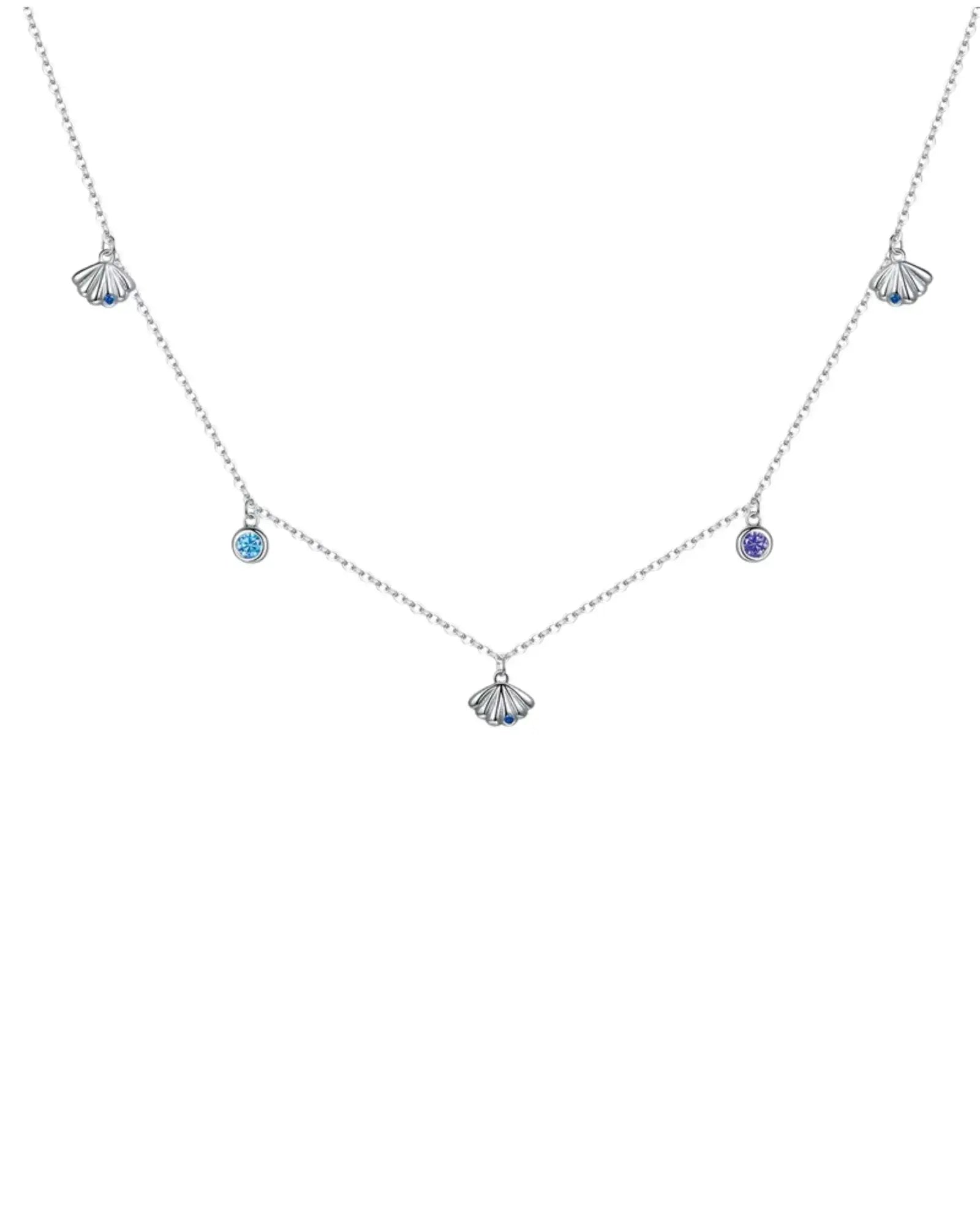 Scallop Charm Necklace in Silver with blue and purple zircon accents, perfect for layering or solo wear, featuring platinum plating.