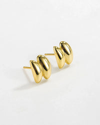 Sculptura Ear Studs in 18k gold, featuring a bold geometric design, perfect for modern elegance.