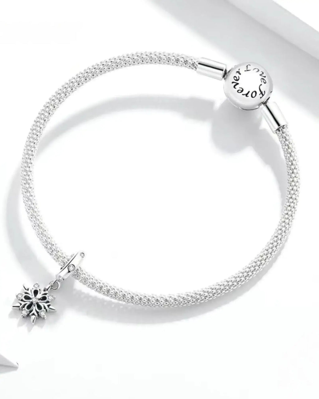 Elegant 925 sterling silver bracelet featuring a unique snowflake charm, perfect for enhancing charm collections.