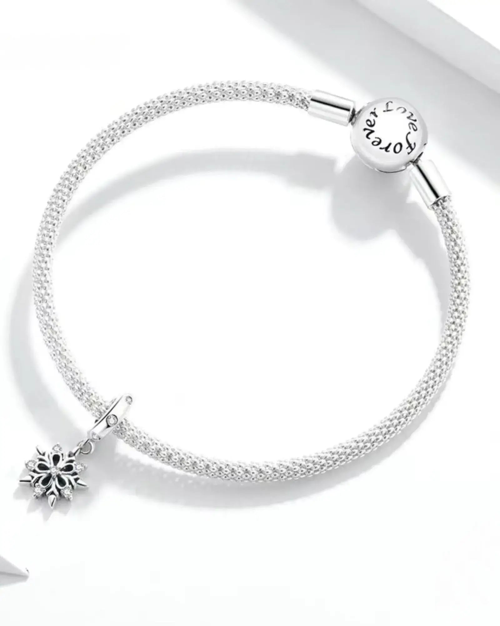 Elegant 925 sterling silver bracelet featuring a unique snowflake charm, perfect for enhancing charm collections.