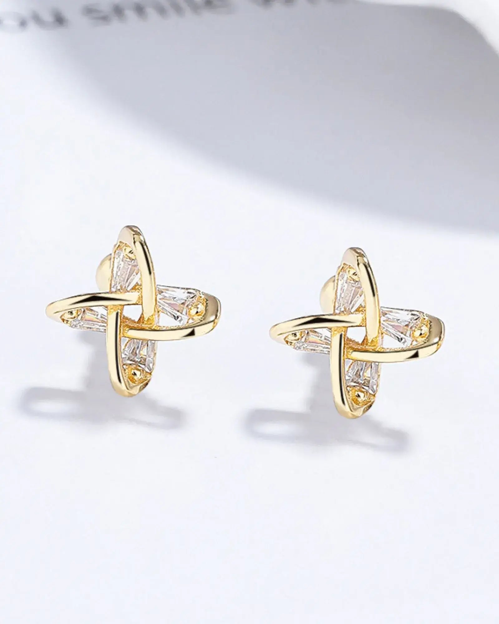 Elegant yellow gold plated stud earrings featuring a unique windmill design, crafted from 925 sterling silver.