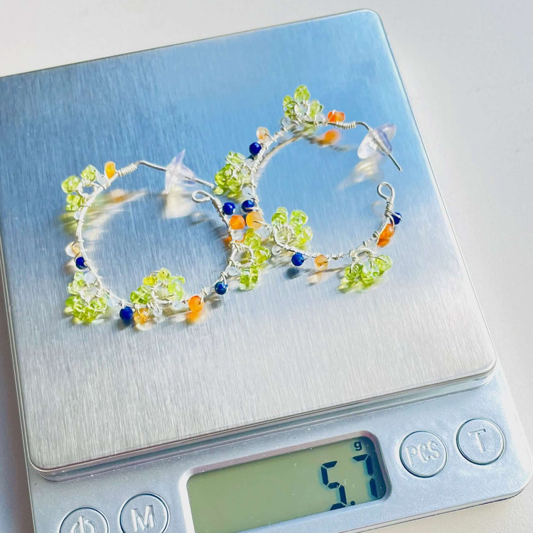 a digital scale with a bracelet on top of it